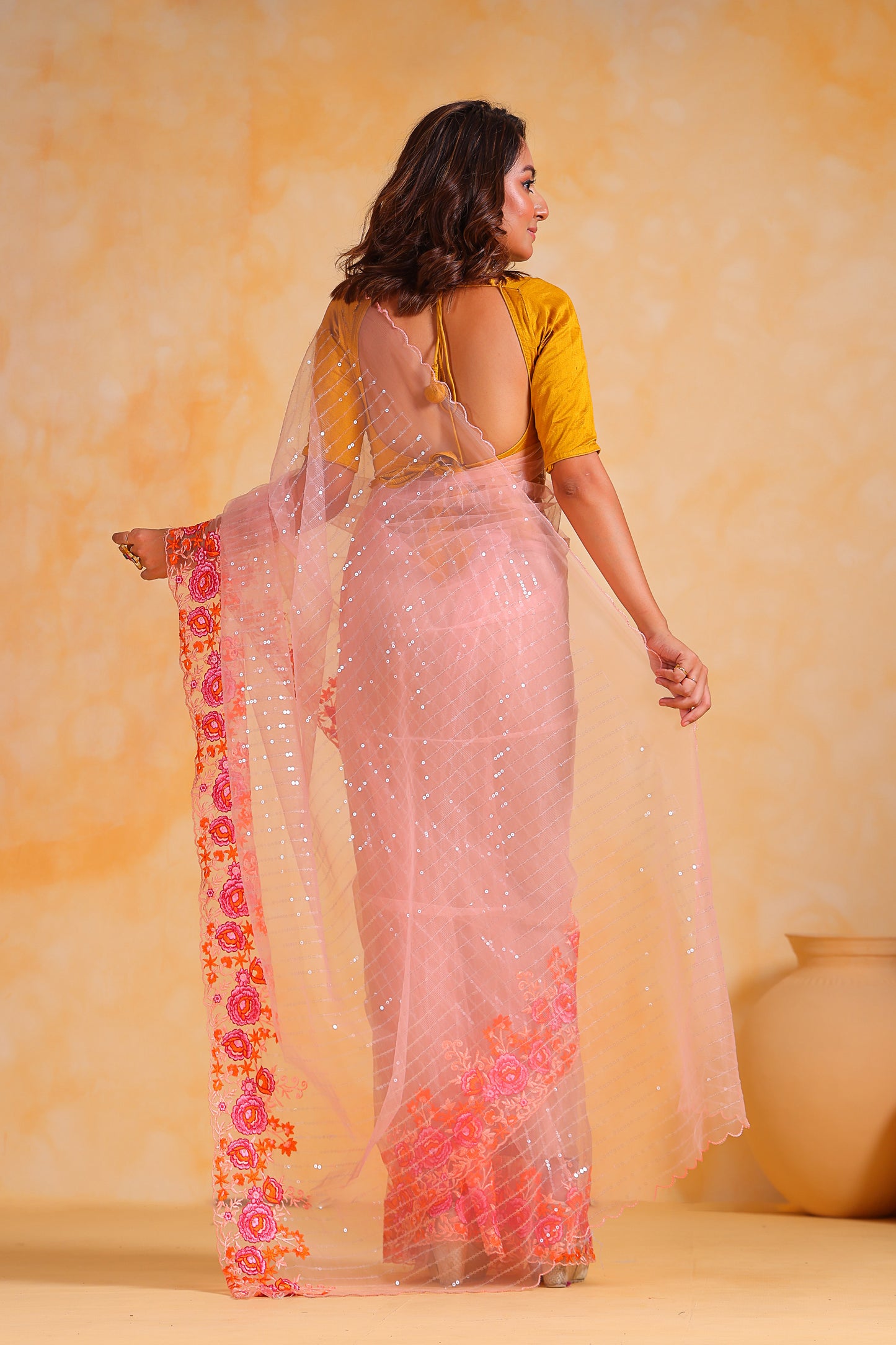 Hand-Embroidered Delicate-Peach Soft Super-Net Saree with All-Over Sequins work & Contrast Blouse