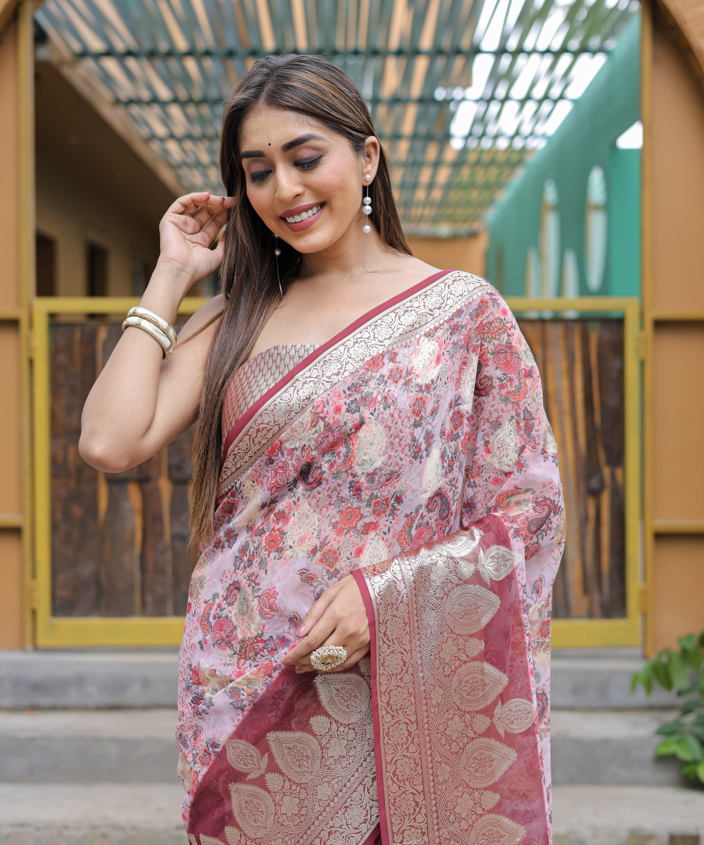 Pure Georgette Salmon-Pink saree in Digital-Print with Maroon Heavy Zari Border and Tassels paired with Blouse