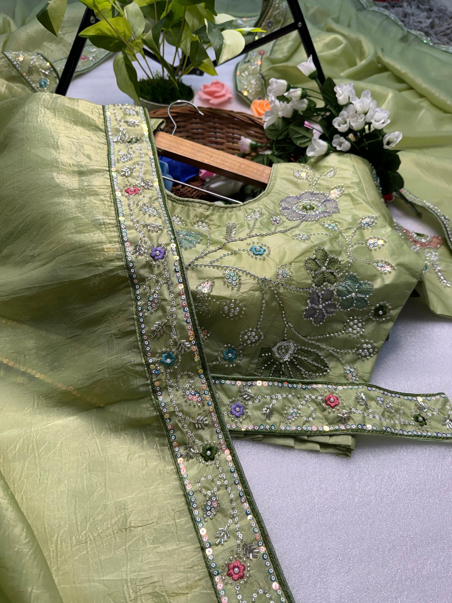 Hand-Embroidered Pure Silk Saree in Mint Green Paired with a Heavily Embroidered Stitched Blouse