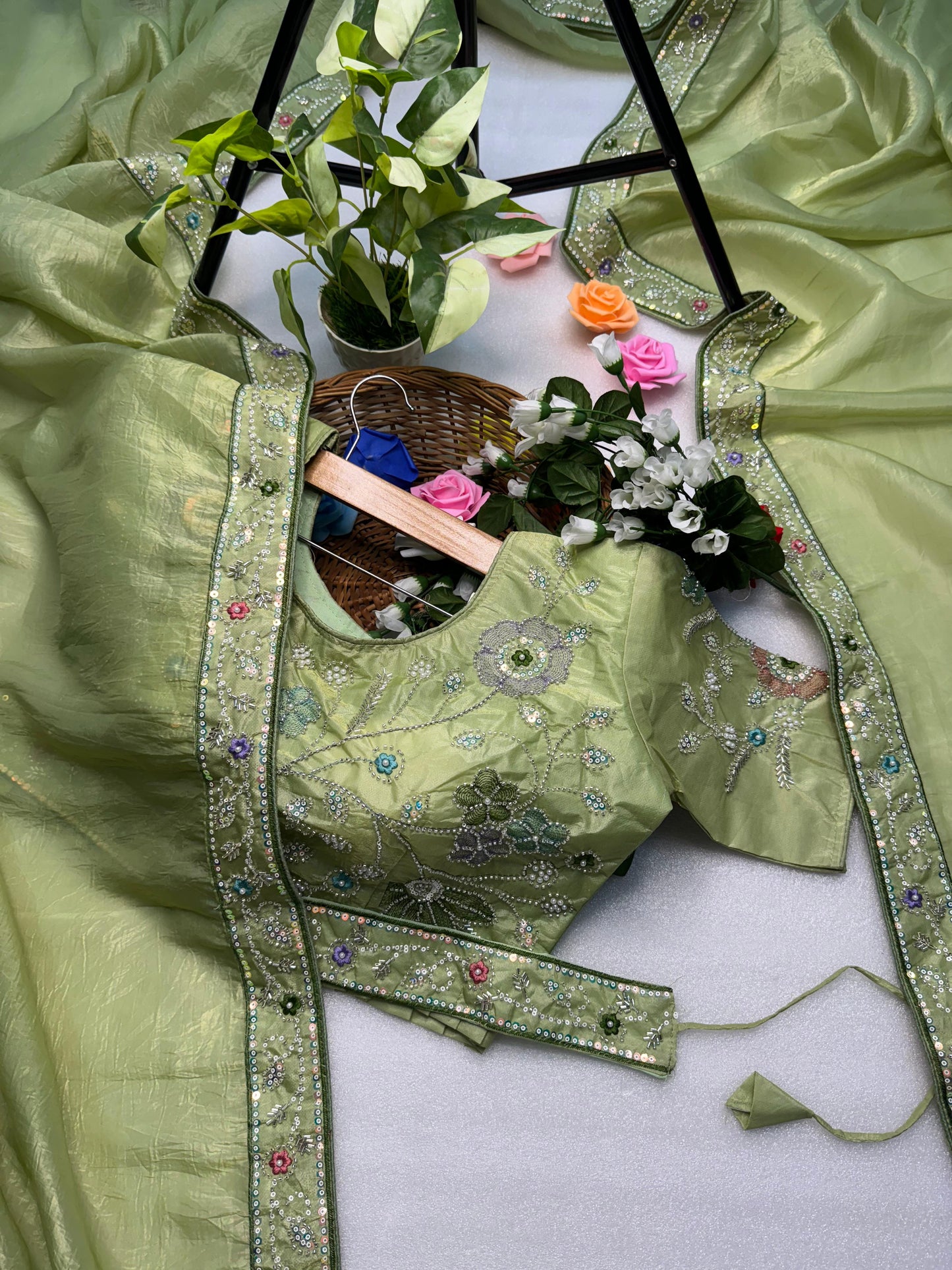 Hand-Embroidered Pure Silk Saree in Mint Green Paired with a Heavily Embroidered Stitched Blouse