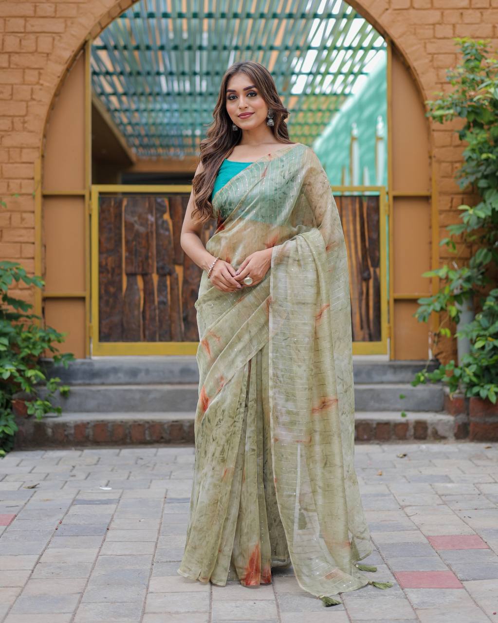 Mehendi-Green Pure Organza-Silk saree with all over Zari Sequins and Tassels paired with Blouse