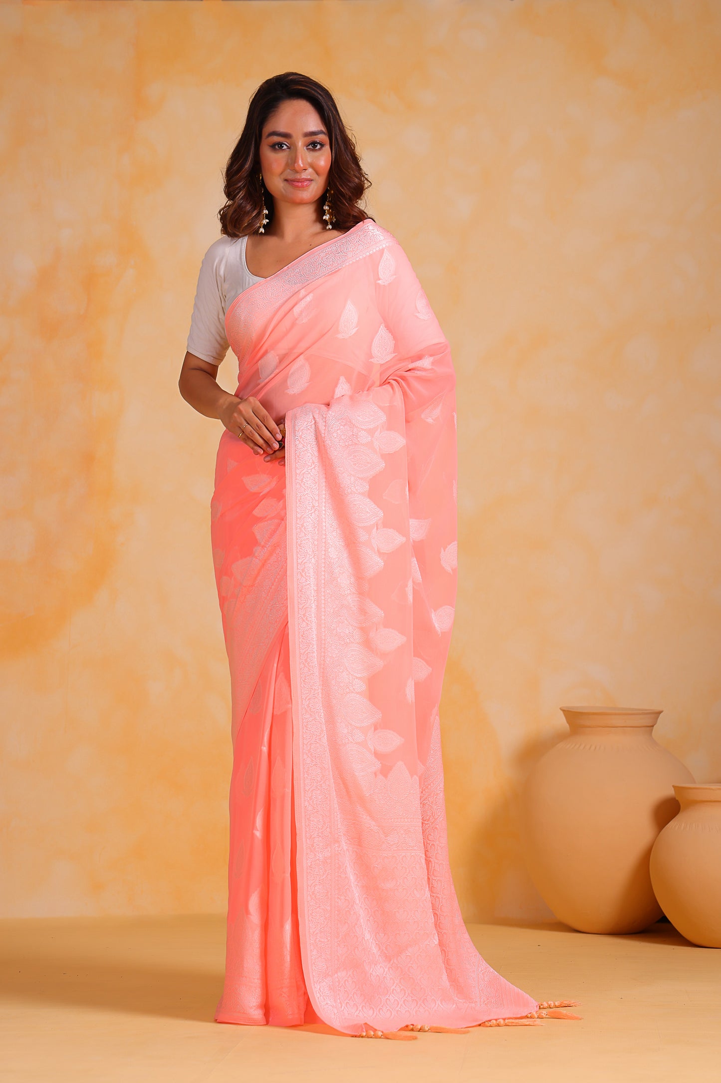 Hand-Woven Peach Pure Georgette-Silk Saree with Tassels and Heavy Blouse