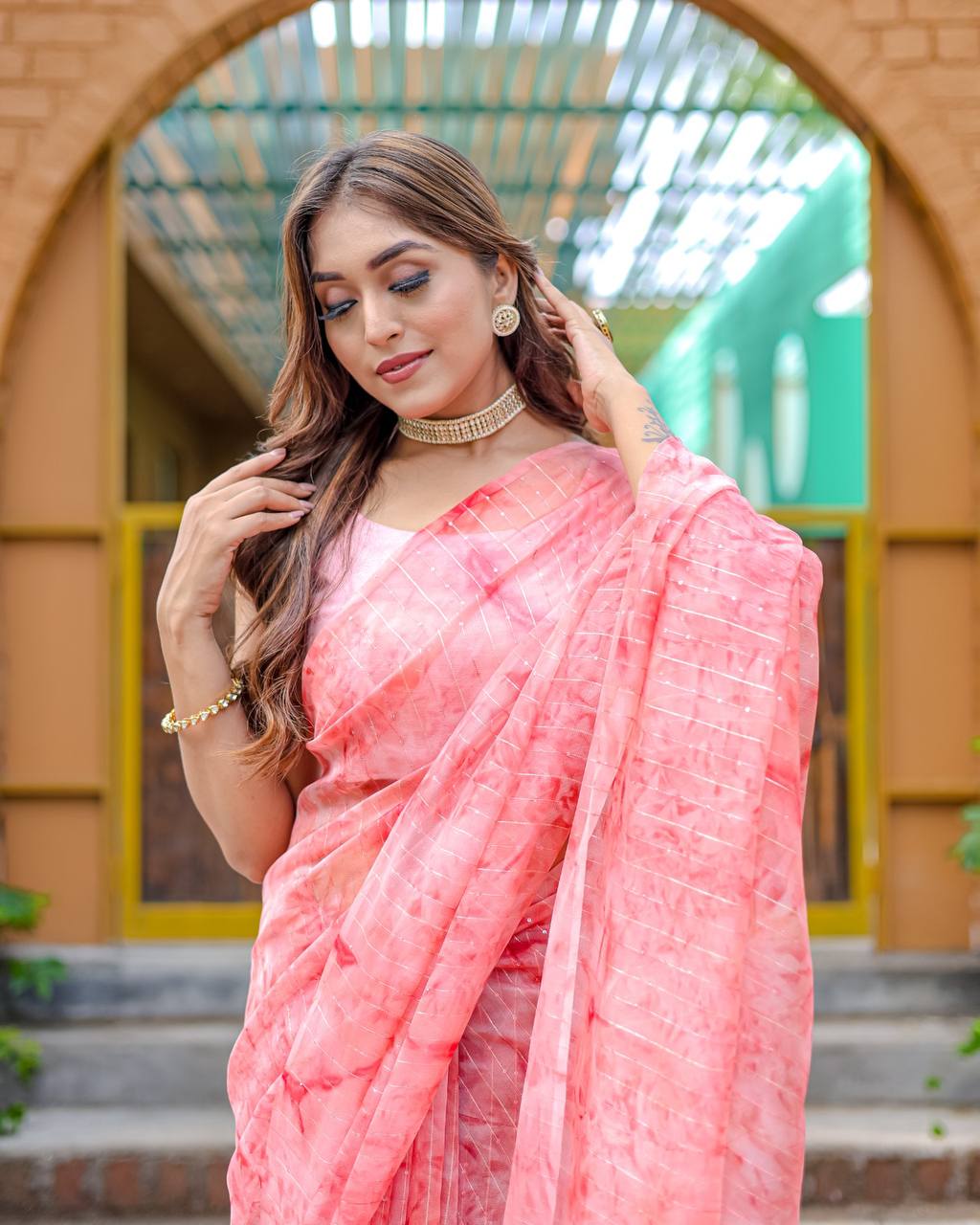Light-Pink Pure Organza-Silk saree with all over Zari Sequins and Tassels paired with Blouse