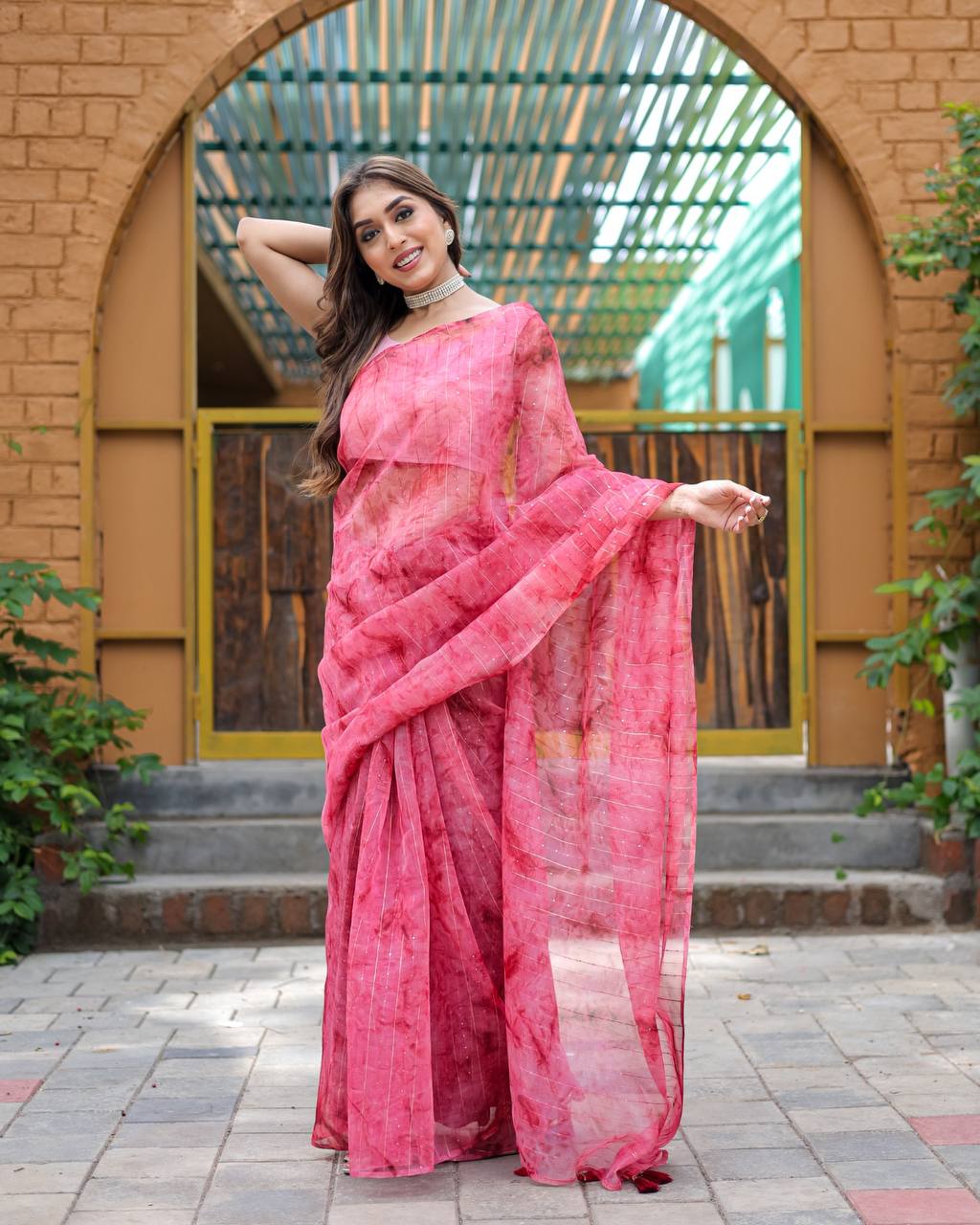 Bright-Pink Pure Organza-Silk saree with all over Zari Sequins and Tassels paired with Blouse