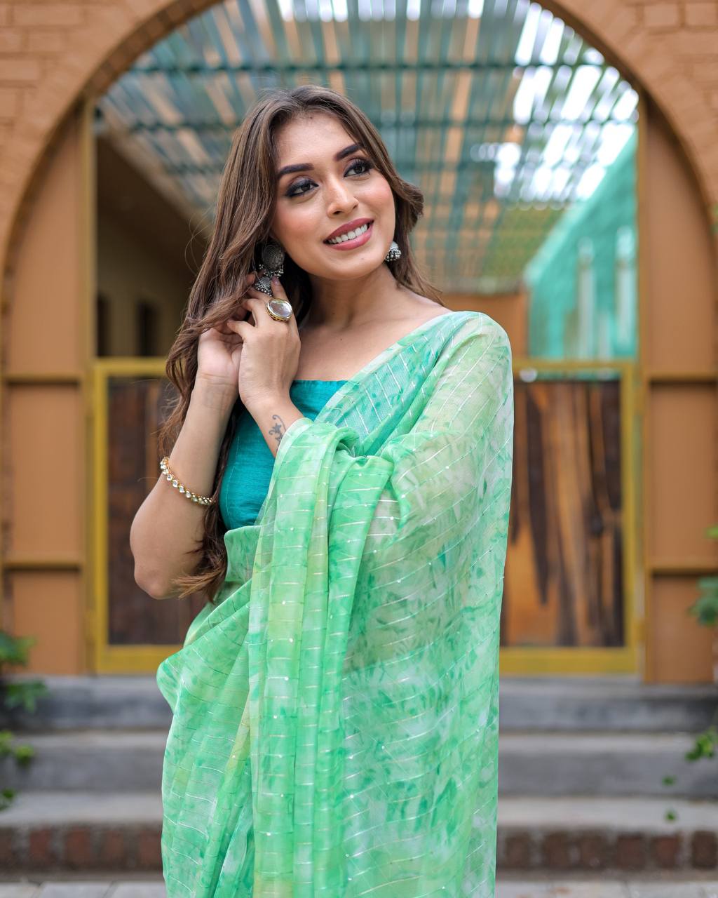 Pista-Green Pure Organza-Silk saree with all over Zari Sequins and Tassels paired with Blouse