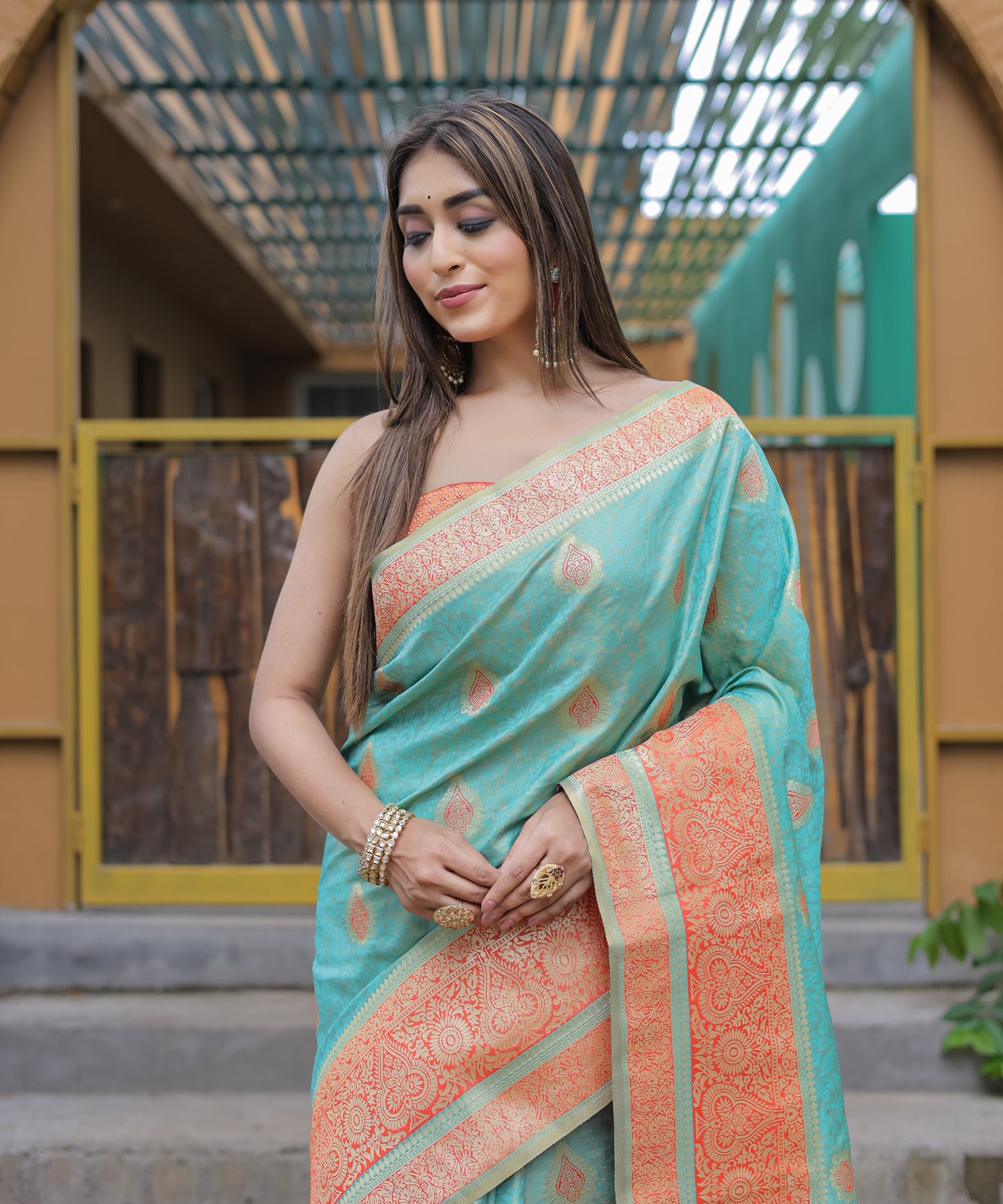 Heavy Embroidered Light-Blue saree with Soft-Orange Zari Border paired with Blouse