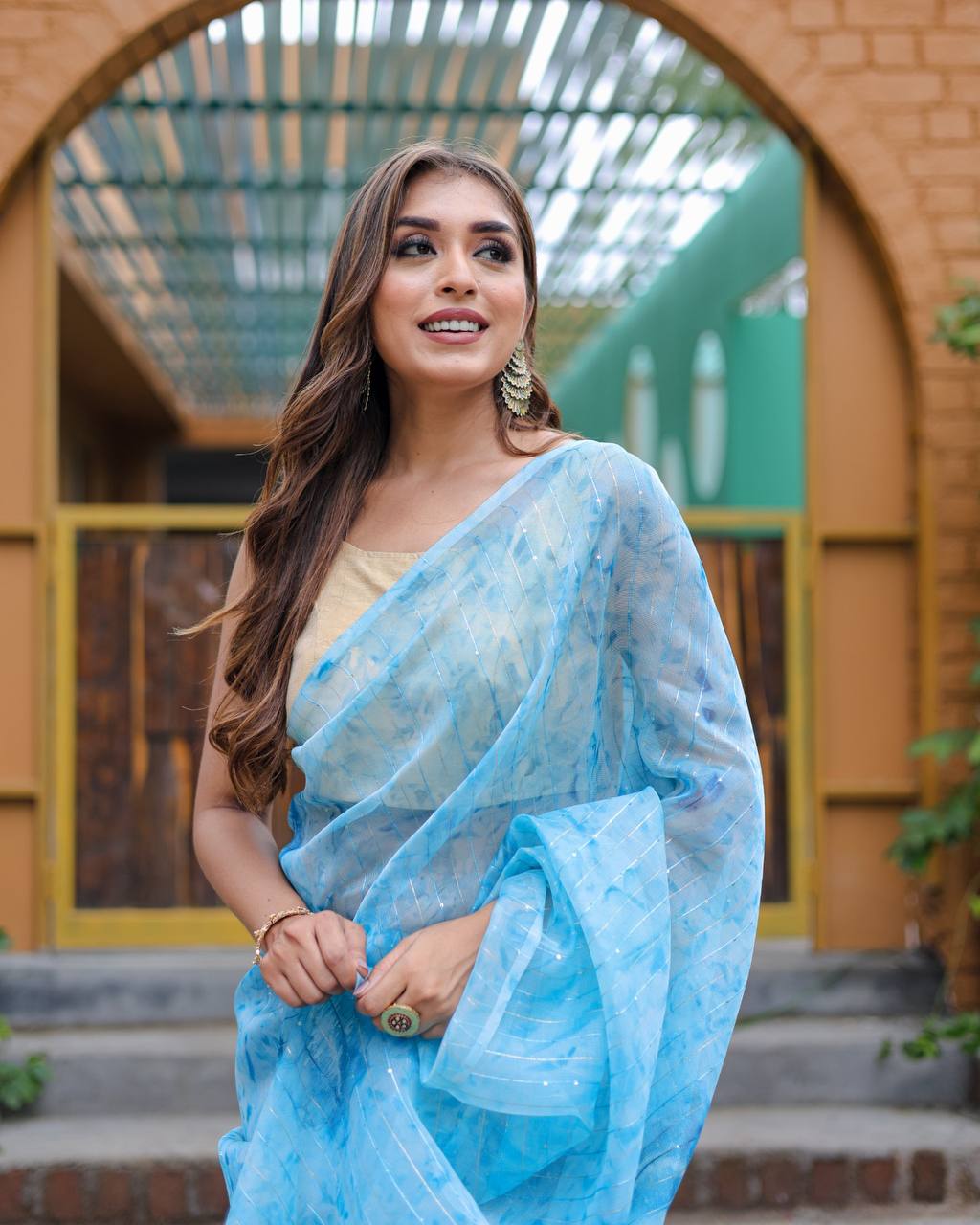 Sky-Blue Pure Organza-Silk saree with all over Zari Sequins and Tassels paired with Blouse