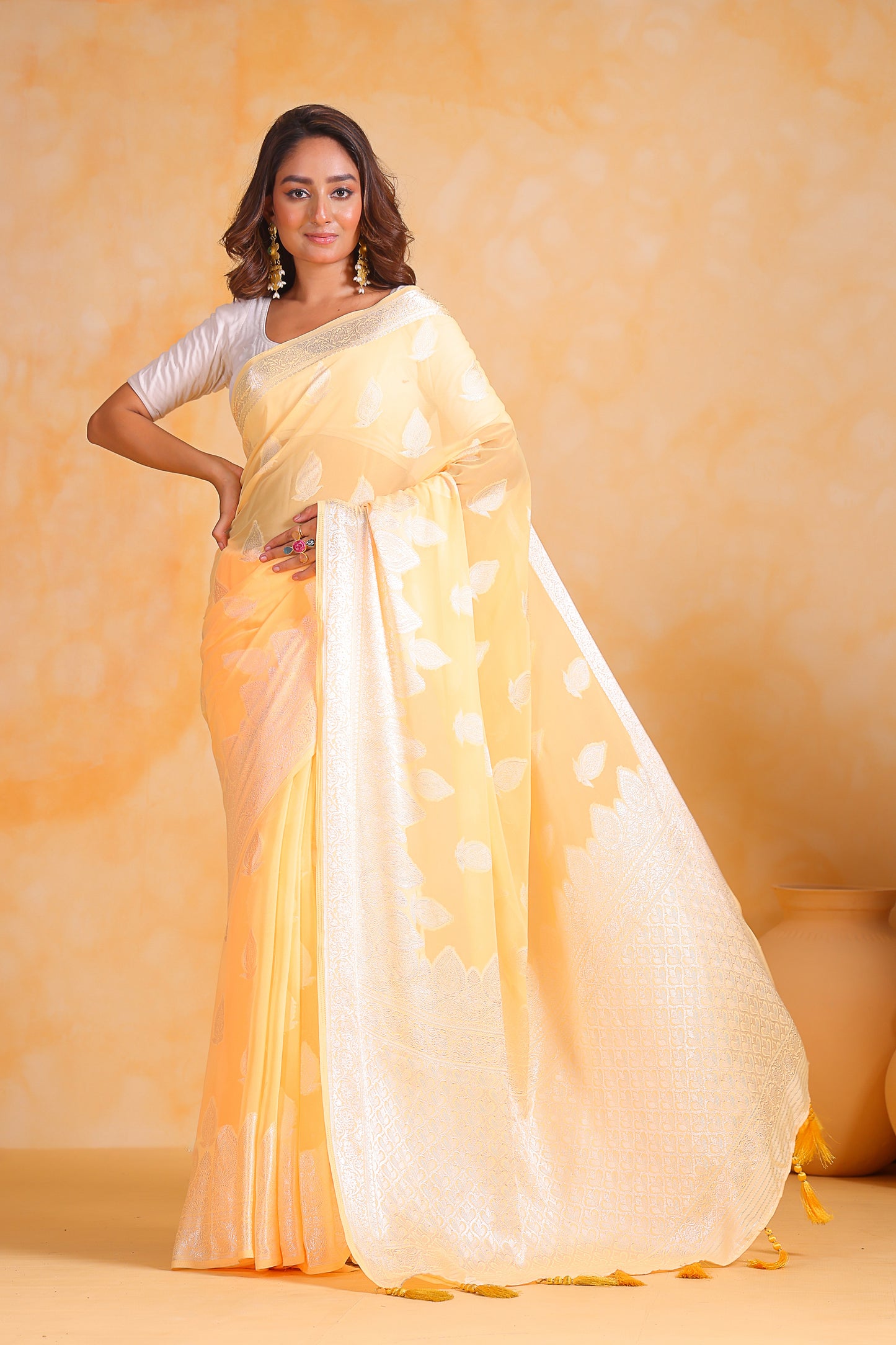 Hand-Woven Lemon-Yellow Pure Georgette-Silk Saree with Tassels and Heavy Blouse