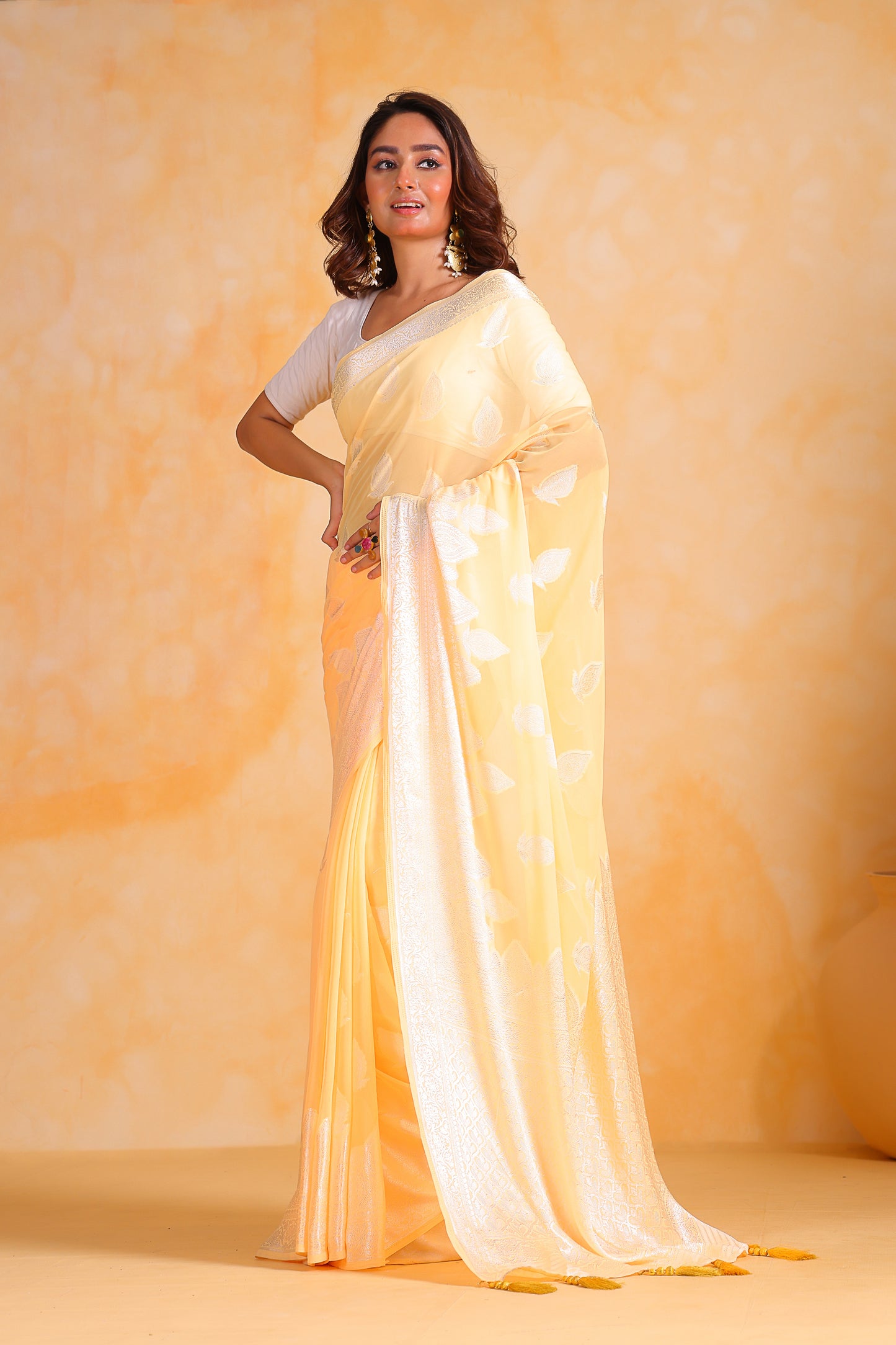 Hand-Woven Lemon-Yellow Pure Georgette-Silk Saree with Tassels and Heavy Blouse