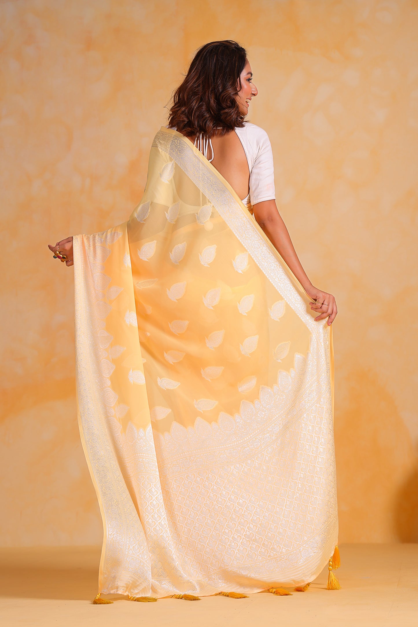 Hand-Woven Lemon-Yellow Pure Georgette-Silk Saree with Tassels and Heavy Blouse